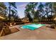 Relaxing poolside oasis with a sparkling swimming pool, comfortable seating, and soft ambient lighting at 9650 Coleman Rd, Roswell, GA 30075