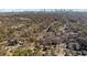 An aerial view of a neighborhood with the Atlanta skyline in the distance on a sunny day at 67 Holly Nw Rd, Atlanta, GA 30314