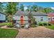 Landscaped backyard with a wood deck, string lights, gravel, and comfortable outdoor seating at 67 Holly Nw Rd, Atlanta, GA 30314