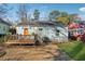 Cozy backyard with a deck, gravel, and some green grass at 67 Holly Nw Rd, Atlanta, GA 30314