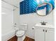 Charming bathroom featuring blue patterned walls and a white vanity at 67 Holly Nw Rd, Atlanta, GA 30314