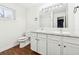 Modern bathroom with double vanity, granite countertops, and tiled shower at 67 Holly Nw Rd, Atlanta, GA 30314