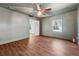 This spacious bedroom has hardwood floors, a ceiling fan and is freshly painted at 67 Holly Nw Rd, Atlanta, GA 30314