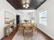 Bright dining room with hardwood floors, a farmhouse table, and an open layout to the kitchen at 67 Holly Nw Rd, Atlanta, GA 30314