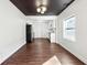 Bright dining room with hardwood floors, a farmhouse table, and an open layout to the kitchen at 67 Holly Nw Rd, Atlanta, GA 30314