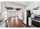 Open kitchen featuring stainless steel appliances and views of the adjacent living area at 67 Holly Nw Rd, Atlanta, GA 30314