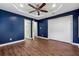 Large main bedroom featuring a walk-in closet, en-suite bathroom and a ceiling fan at 67 Holly Nw Rd, Atlanta, GA 30314