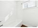 The clean, white tiled shower offers a bright and refreshing space at 67 Holly Nw Rd, Atlanta, GA 30314