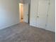 Spacious carpeted bedroom has white walls and includes 2 closets at 2120 Boxwood Se Cir, Conyers, GA 30094