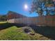 Private backyard with wooden fence and green grass at 2382 Old Rex Morrow Rd, Ellenwood, GA 30294