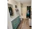 Teal vanity, updated fixtures, and a tub shower at 2382 Old Rex Morrow Rd, Ellenwood, GA 30294