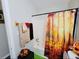 Bathroom with tub shower and fall-themed decor at 2382 Old Rex Morrow Rd, Ellenwood, GA 30294