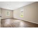 Spacious bedroom showcasing beautiful wood-look flooring and neutral paint, ready for personalization at 2382 Old Rex Morrow Rd, Ellenwood, GA 30294