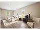 Stylishly furnished bedroom featuring wood flooring, ample natural light, and neutral walls at 2382 Old Rex Morrow Rd, Ellenwood, GA 30294