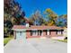 Brick ranch home with a large yard and driveway at 2382 Old Rex Morrow Rd, Ellenwood, GA 30294