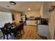 Kitchen features white cabinets, granite countertops, and a dining area at 2382 Old Rex Morrow Rd, Ellenwood, GA 30294