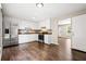 Bright kitchen with white cabinets and a stainless steel refrigerator at 2382 Old Rex Morrow Rd, Ellenwood, GA 30294