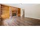 Living room featuring hardwood floors, a brick fireplace and built-in bookshelves at 2382 Old Rex Morrow Rd, Ellenwood, GA 30294