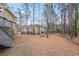 Spacious backyard with a fire pit and wooded area at 610 Ashwood Ct, Woodstock, GA 30189