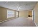 Spacious finished basement with neutral carpeting and ample natural light at 610 Ashwood Ct, Woodstock, GA 30189