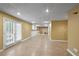 Finished basement with tile flooring, plenty of space and access to patio at 610 Ashwood Ct, Woodstock, GA 30189
