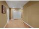 Basement hallway with tile flooring and double doors at 610 Ashwood Ct, Woodstock, GA 30189