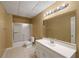 Basement bathroom with single vanity, shower/tub, and tile flooring at 610 Ashwood Ct, Woodstock, GA 30189