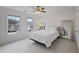 Bright bedroom with large windows and ceiling fan at 610 Ashwood Ct, Woodstock, GA 30189
