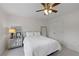 Spacious bedroom with mirrored furniture and ceiling fan at 610 Ashwood Ct, Woodstock, GA 30189