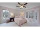 Charming bedroom with a window seat and ceiling fan at 610 Ashwood Ct, Woodstock, GA 30189