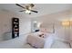 Well-lit bedroom with double doors and ceiling fan at 610 Ashwood Ct, Woodstock, GA 30189