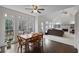 Bright breakfast nook with wooden table and chairs, adjacent to kitchen at 610 Ashwood Ct, Woodstock, GA 30189