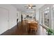 Bright dining area with hardwood floors and view into kitchen at 610 Ashwood Ct, Woodstock, GA 30189