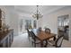 Formal dining room with hardwood floors and a view of the backyard at 610 Ashwood Ct, Woodstock, GA 30189