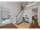 Two-story entryway with hardwood floors, a grand staircase, and high ceilings at 610 Ashwood Ct, Woodstock, GA 30189