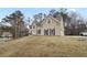 Two-story house with a stone facade, landscaped yard, and attached garage at 610 Ashwood Ct, Woodstock, GA 30189