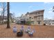 Two-story house with a large deck and firepit area at 610 Ashwood Ct, Woodstock, GA 30189