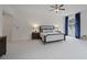 Spacious main bedroom with large windows and carpeted floor at 610 Ashwood Ct, Woodstock, GA 30189