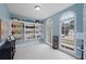 Home office with built-in shelves, an arched window, and a light blue wall at 610 Ashwood Ct, Woodstock, GA 30189