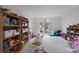 Playroom with colorful toys, bookshelves, and a large window at 610 Ashwood Ct, Woodstock, GA 30189