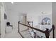 Bright upper hallway with chandelier and staircase at 610 Ashwood Ct, Woodstock, GA 30189