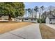 Front view of a white brick house with a long driveway at 705 Glenforest Rd, Atlanta, GA 30328