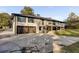 Back exterior view of house, showcasing deck and garage at 705 Glenforest Rd, Atlanta, GA 30328