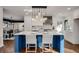 Blue kitchen island with white countertop and pendant lighting at 705 Glenforest Rd, Atlanta, GA 30328