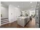 Modern kitchen with gray cabinetry, island, and hardwood floors at 1036 Culpepper Nw St, Atlanta, GA 30318