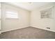 Well-lit bedroom featuring neutral walls and carpet at 3860 Wisteria Sw Ln, Atlanta, GA 30331