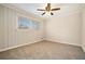 Charming bedroom with wood paneling and ceiling fan at 3860 Wisteria Sw Ln, Atlanta, GA 30331