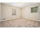 Spacious bedroom with neutral carpeting and ample natural light at 3860 Wisteria Sw Ln, Atlanta, GA 30331