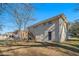 Rear view of house with a deck and grassy yard at 3860 Wisteria Sw Ln, Atlanta, GA 30331
