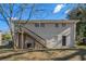 Rear view of house showcasing deck and landscaping at 3860 Wisteria Sw Ln, Atlanta, GA 30331